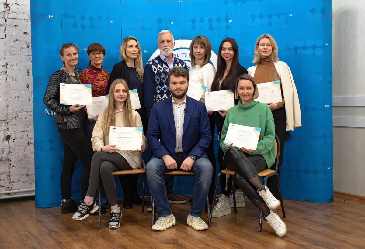 Andrei Efremov with participants on the graduation day of an in-person course